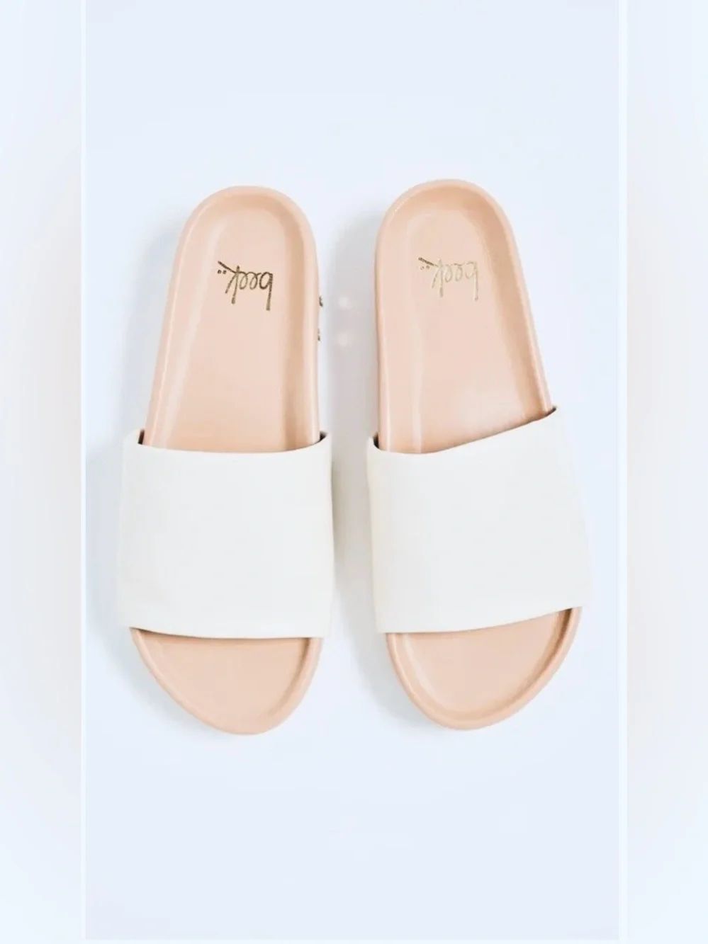 Beek Pelican sandals with a white leather upper strap and a tan molded footbed